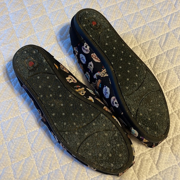 BOBS By Skechers slip on shoes in black with various dog designs on the shoes. - Picture 6 of 8
